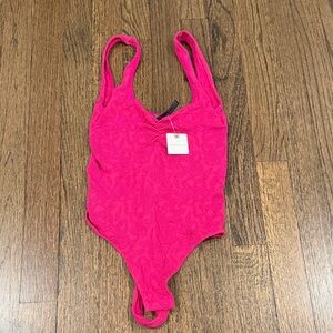 Pink bodysuit